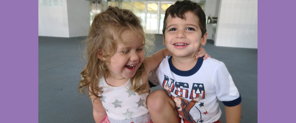 Young Boy and Girl Laughing at Childcare in Coral Gables, South Miami, Coconut Grove, and Pinecrest, FL