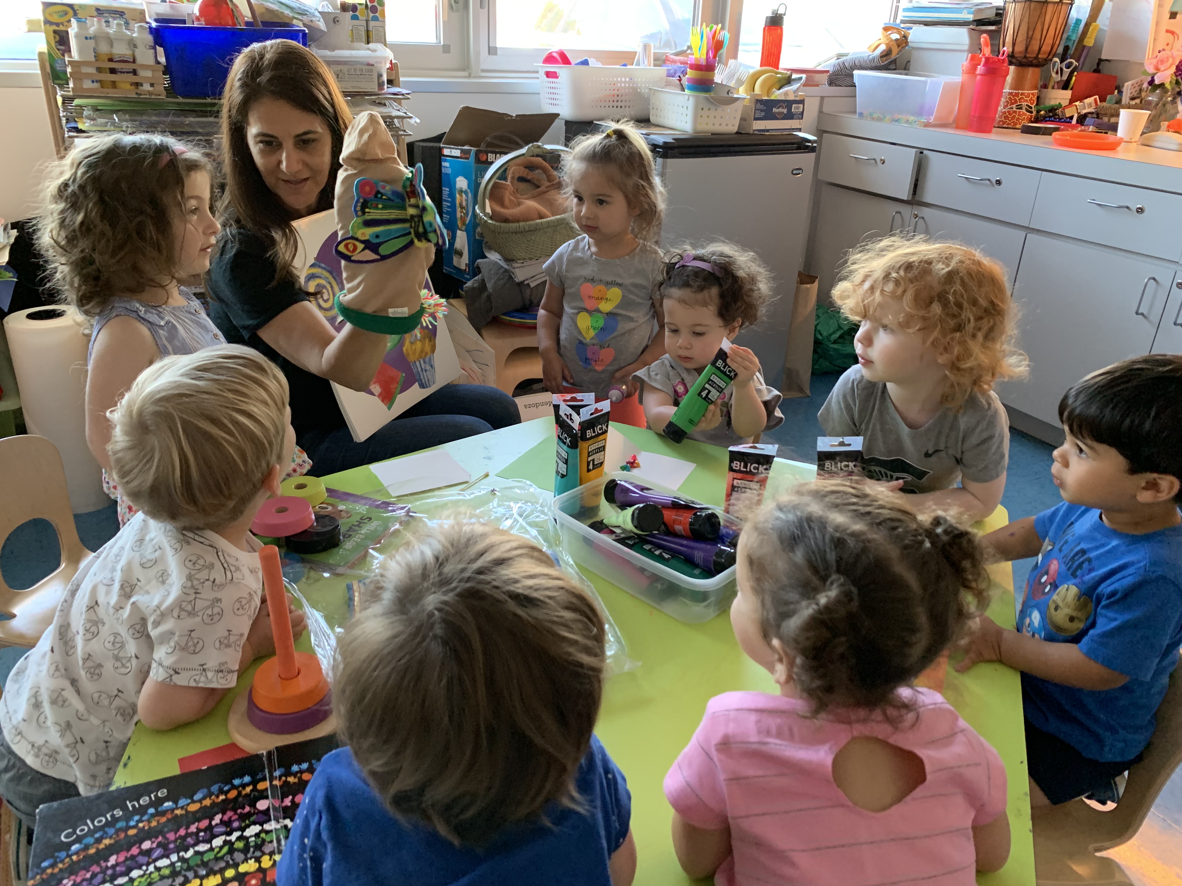 Toddler at Daycare Sitting in a Circle with Teacher in Pinecrest, Coconut Grove, South Miami, Coral Gables