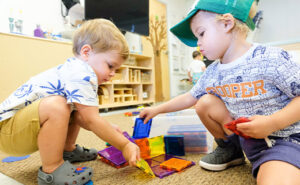 2 toddler boys building at Daycare in South Miami, Pinecrest, FL, Coral Gables, and Coconut Grove