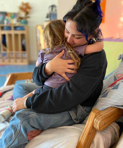 School careers-teacher comforting child